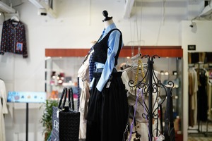 Select shop floor featuring mannequins and handbags