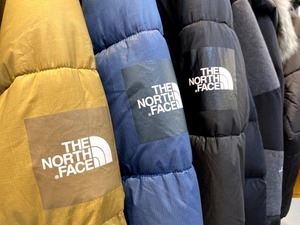 Close-up of The North Face down jackets on display