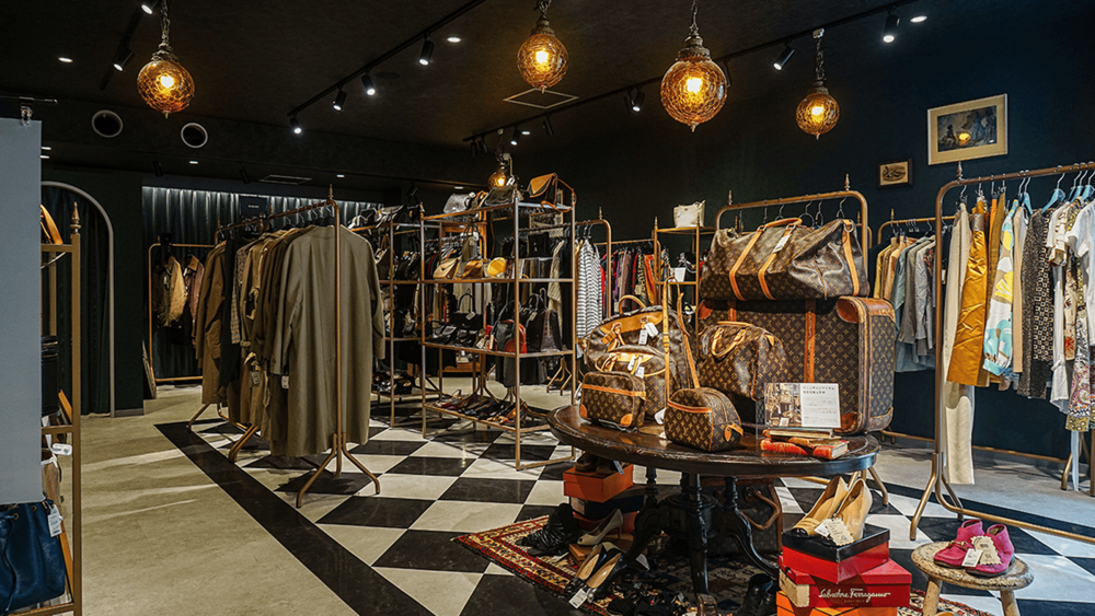 Store interior featuring Louis Vuitton bags, clothing, and shoes